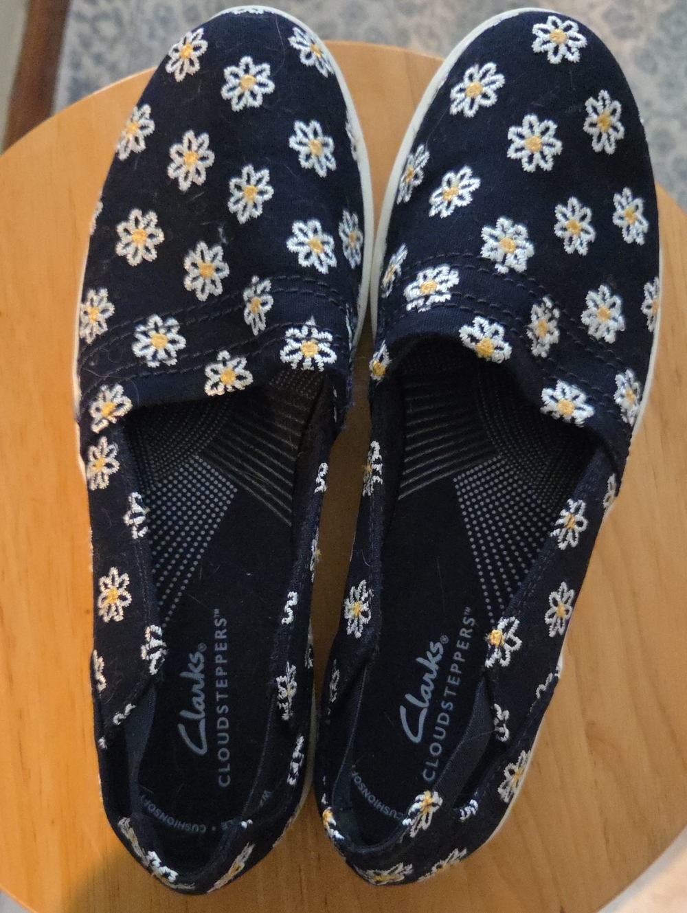 Clarks Navy Slip-On Moccasins with White and Yellow Daisy Embroidery